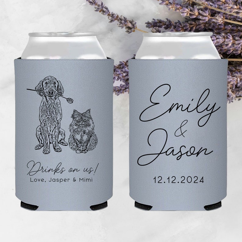 May include: Two gray can coolers with black text. One cooler features a line drawing of a dog and cat with the text "Drinks on us! Love, Jasper & Mimi". The other cooler has the text "Emily & Jason 12.12.2024".