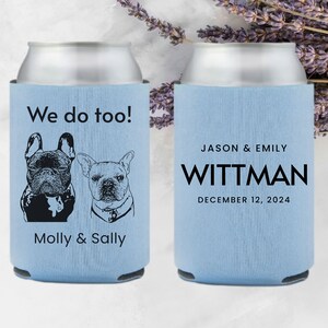 May include: Two light blue can coolers with black text and images. One cooler says "We do too!" with two black and white illustrations of French Bulldogs. The other cooler says "JASON & EMILY WITTMAN DECEMBER 12, 2024".