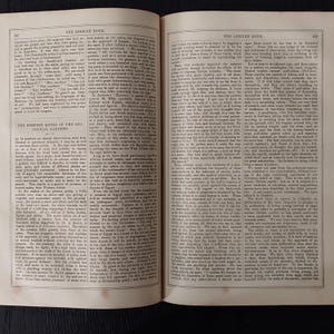 May include: Open book pages with text, featuring columns of printed words. The pages are aged, with a yellowed hue. The text includes the title "THE LEISURE HOUR" and the section "THE SERPENT HOUSE OF THE ZOO-LOGICAL GARDENS."