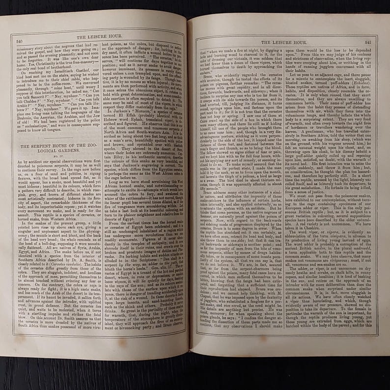 May include: Open book pages with text, featuring columns of printed words. The pages are aged, with a yellowed hue. The text includes the title "THE LEISURE HOUR" and the section "THE SERPENT HOUSE OF THE ZOO-LOGICAL GARDENS."