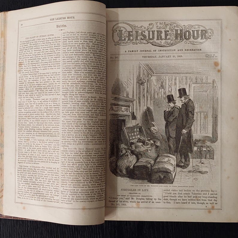 May include: An open book with text and illustrations. The title "The Leisure Hour" is visible at the top, with an illustration of two men in a room with luggage. The date "Thursday, January 25, 1855" is also visible.