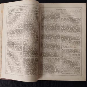 May include: Open book with text, titled "The Leisure Hour." The pages are yellowed, suggesting age. The text is in black ink, with a classic serif font. The book is open to a double-page spread, with text filling both pages.