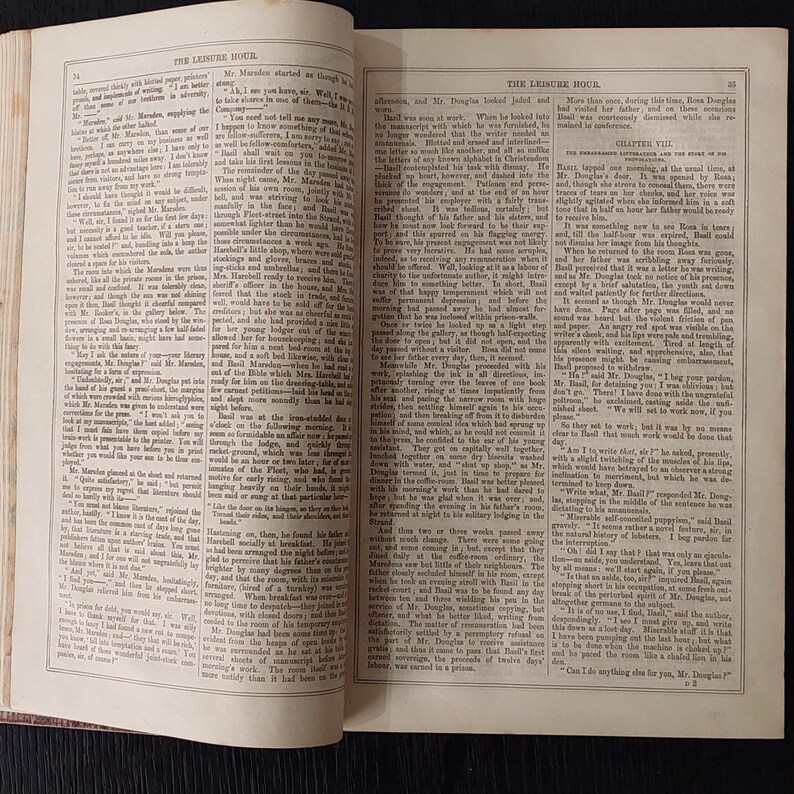 May include: Open book with text, titled "The Leisure Hour." The pages are yellowed, suggesting age. The text is in black ink, with a classic serif font. The book is open to a double-page spread, with text filling both pages.