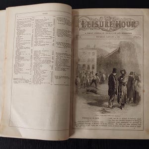 May include: An open book with a black and white illustration of a street scene with people. The text "THE LEISURE HOUR" is at the top, with the date "THURSDAY, JANUARY 4, 1855". The left page has a list of text.