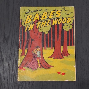 May include: A vintage comic book cover with the title "The Story of Babes in the Wood." The illustration shows a forest scene with two figures beneath a large tree. The title is in yellow against a green backdrop.
