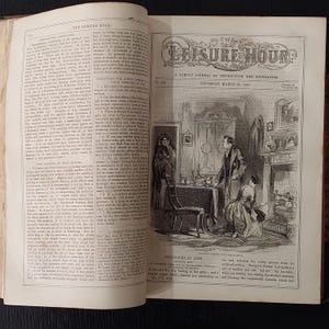 May include: An open book with a black and white illustration titled "The Leisure Hour." The illustration depicts a domestic scene with figures in period clothing, a fireplace, and furniture. The text includes the date "Thursday, March 29, 1866."