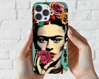 May include: A phone case with a colorful illustration of Frida Kahlo, a famous Mexican painter, with a flower in her hand. The case features a floral design with a blue background.