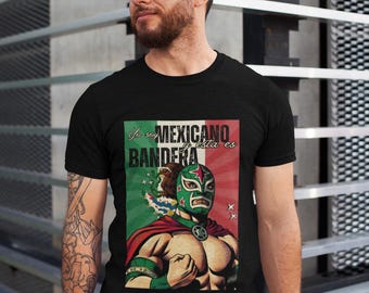 May include: Black t-shirt with a graphic print of a wrestler wearing a green and red mask. The text on the shirt reads "Yo soy MEXICANO y esta es BANDERA".
