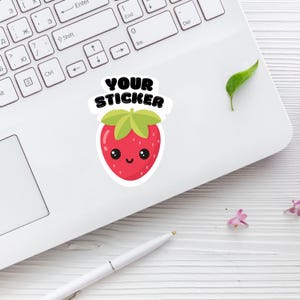 May include: A white laptop with a red and green strawberry sticker that says "YOUR STICKER".