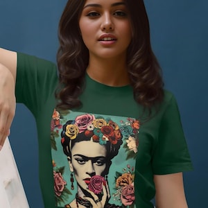 May include: A green t-shirt with a colorful graphic print of Frida Kahlo wearing a flower crown and holding a flower.