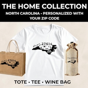 May include: A white t-shirt, a tan burlap tote bag, and a tan burlap wine bag. Each item features a black graphic of the state of North Carolina with the text "Home 27614" and a landscape scene. The wine bag also includes the word "Congratulations."