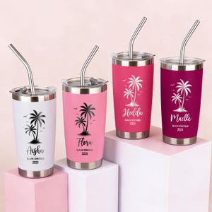 May include: Four stainless steel tumblers with lids and straws. Each tumbler is a different color: white, pink, hot pink, and burgundy. Each tumbler has a black palm tree design and a name with "San Diego 2026" text.