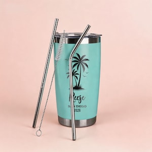 May include: A teal travel tumbler with a black palm tree design and the name "Reese" printed on it. Includes two stainless steel straws and a straw cleaner. The tumbler is designed for cold beverages and has a silver lid and base.