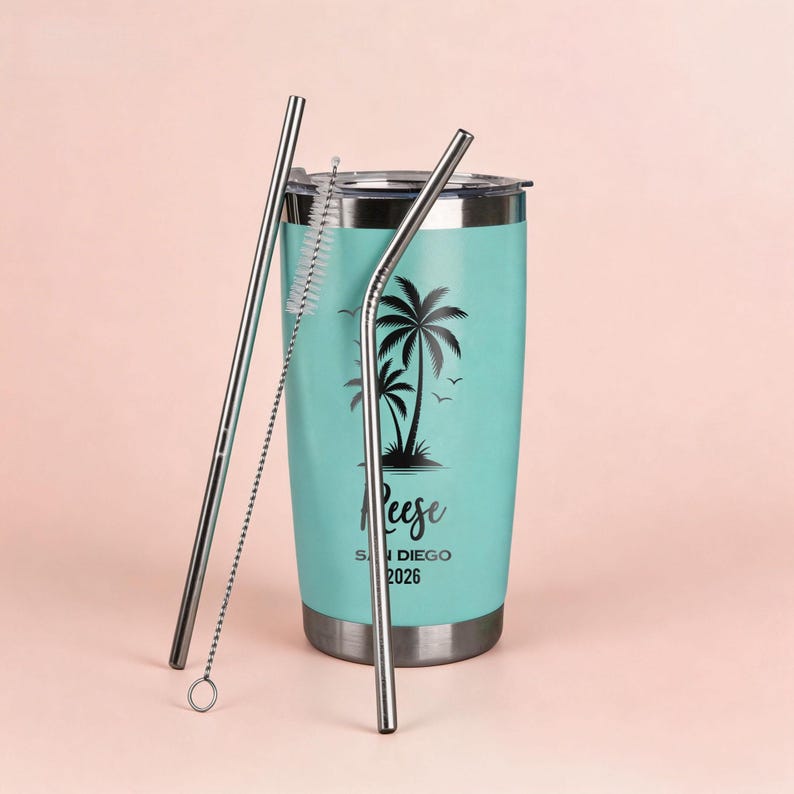 May include: A teal travel tumbler with a black palm tree design and the name "Reese" printed on it. Includes two stainless steel straws and a straw cleaner. The tumbler is designed for cold beverages and has a silver lid and base.