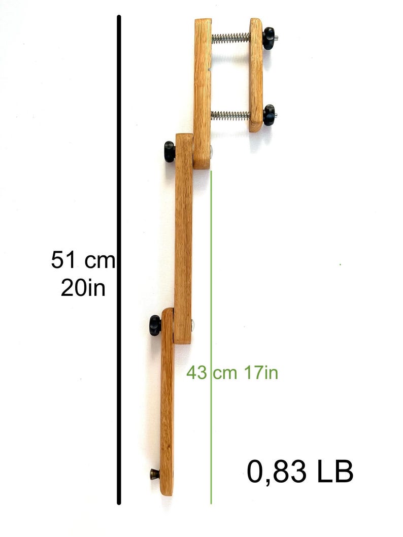 A light brown wooden Mahlstick stand, 51cm (20in) tall and 43cm (17in) wide, weighing 0.83 lbs.  The stand features two adjustable Mahlstick and is constructed from light-colored wood with black metal accents.  It's a versatile woodworking tool, ideal for various crafting and hobby projects.