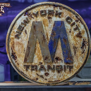 May include: A rusty metal sign with the text "NEW YORK CITY TRANSIT" and a blue and silver "M" in the center.