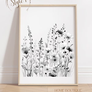 May include: Black and white watercolor print of a floral bouquet with a variety of flowers and leaves. The print is framed in a light wood frame.