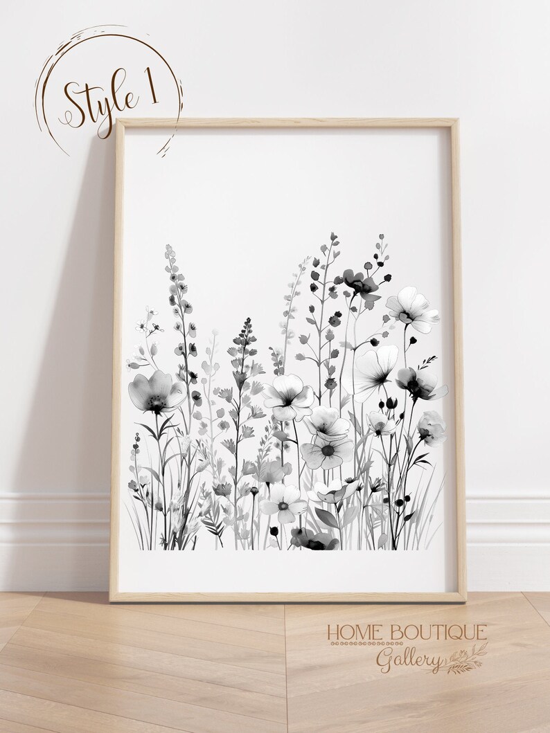 May include: Black and white watercolor print of a floral bouquet with a variety of flowers and leaves. The print is framed in a light wood frame.