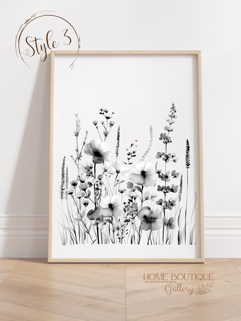 May include: Black and white watercolor print of a bouquet of wildflowers in a simple wooden frame. The print features a variety of flowers and grasses, including daisies, poppies, and ferns. The print is perfect for adding a touch of nature to any room.
