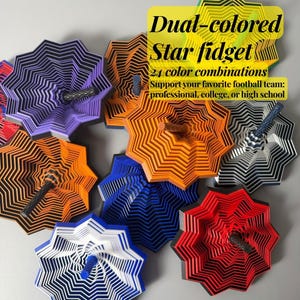 May include: A collection of multi-layered, star-shaped fidget spinners in various dual-color combinations including purple, orange, blue, red, white, and black. Each spinner features a central textured handle and text reading Dual-colored Star fidget.