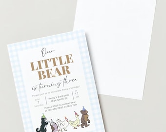 May include: A blue and white gingham patterned invitation with the text "Our Little Bear is turning three" in brown text. The invitation includes details for a birthday party, including the date, time, and location. The bottom of the invitation features a line of cartoon animals, including a bear, a cat, a chicken, and an owl.