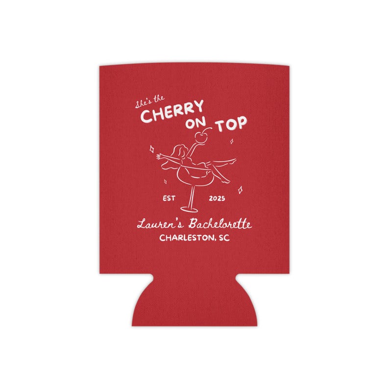 May include: Red drink koozie with white text and a graphic of a person on a cocktail glass. The text reads "She's the Cherry on Top" and "Lauren's Bachelorette Charleston, SC".