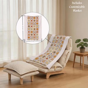 May include: A customizable blanket with a colorful geometric pattern, measuring 30 inches wide and 40 inches long. The design features squares with floral and abstract motifs in yellow, red, and blue. The blanket is displayed on a chair.