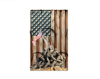 May include: A weathered wooden background with an American flag and a bronze sculpture of soldiers raising a flag. The flag is red, white, and blue with white stars on a blue field. The soldiers are in a raised position, with their arms outstretched.