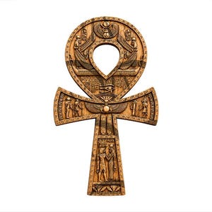 May include: A tan-colored ankh symbol featuring intricate relief carvings of Egyptian deities, hieroglyphics, and a central Eye of Horus. The design includes winged figures, a scarab beetle at the top, and detailed human-like forms along the vertical stem.