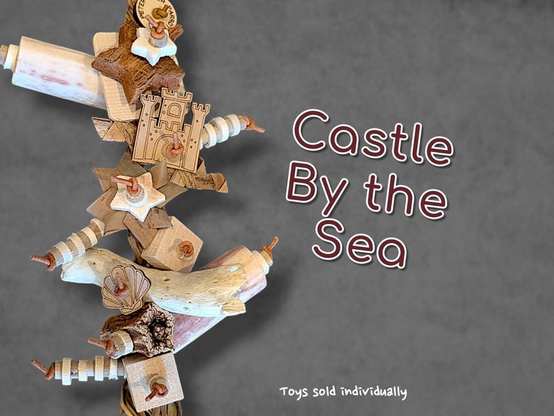May include: A vertical bird toy featuring natural wood pieces, white star-shaped elements, and a laser-cut wooden castle shape. The toy includes textured driftwood, small wooden blocks, and striped beads strung together. Text reads Castle By the Sea.