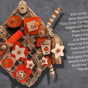 May include: A square woven seagrass mat bird toy featuring orange and natural wood elements including balsa stars, squares, sola sticks, jute beads, a palm leaf forager, coconut star, mahogany pod, banana leaf roll, and a pumpkin spice latte tag.