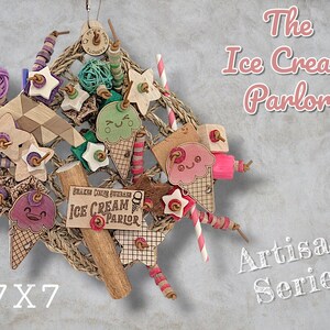 May include: A hanging bird toy featuring a woven square base adorned with wooden ice cream cone cutouts, stars, and colourful beads. The toy includes a sign reading The Ice Cream Parlor and measures 17.8x17.8 cm, designed for avian enrichment.