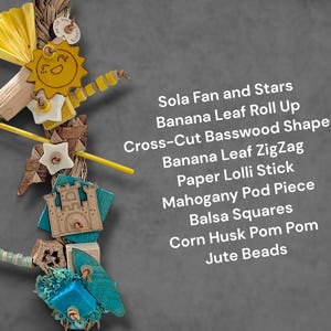 May include: A bird toy featuring a vertical arrangement of Sola fan and stars, banana leaf roll up, cross-cut basswood shapes, banana leaf zigzag, paper lolli stick, mahogany pod piece, balsa squares, corn husk pom pom, and jute beads on a rope.