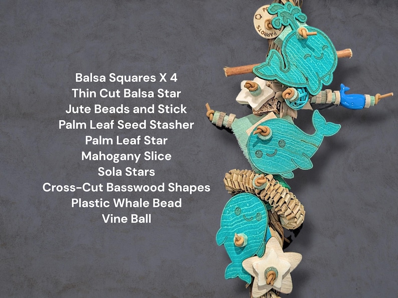 May include: A bird toy featuring turquoise whale shapes, balsa squares, a thin cut balsa star, jute beads, a stick, a palm leaf seed stasher, a palm leaf star, a mahogany slice, sola stars, cross-cut basswood shapes, a plastic whale bead, and a vine ball.