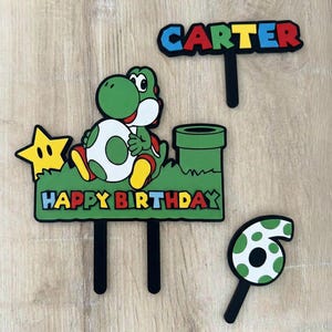 May include: A trio of ceramic mugs with a speckled, matte finish in cream, light grey, and dark grey. Each mug features a minimalist design and a rounded handle. Suitable for tea or coffee, these mugs offer a simple, modern aesthetic.