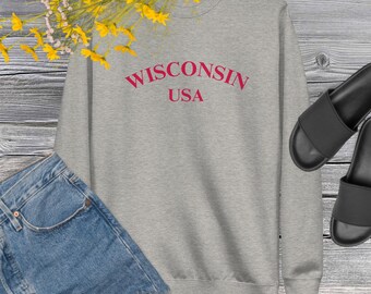 May include: Gray sweatshirt with the text "WISCONSIN USA" in red.