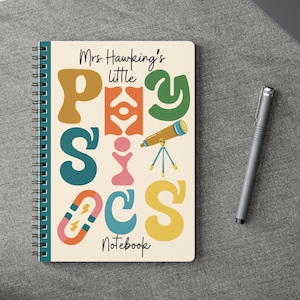 May include: A spiral bound notebook with a cream coloured cover featuring the word "Physics" in large, colourful letters. The letters are decorated with science-themed illustrations, including a magnet, a telescope, and a light bulb. The text "Mrs. Hawking's little Notebook" is printed at the top of the cover.