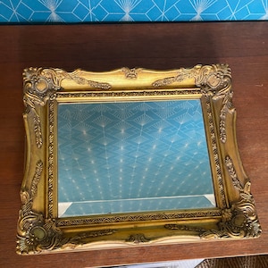 Antique mirror from France, mid-19th century, beveled glass and gilded wood frame, in very good condition.