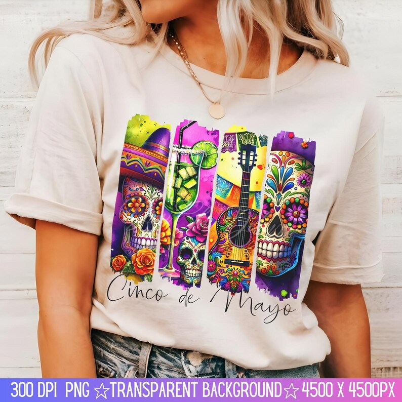 May include: A white t-shirt with a colorful graphic design featuring a guitar, a margarita glass, and a sugar skull. The text "Cinco de Mayo" is printed below the graphic.