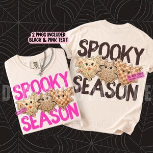 May include: Two off-white t-shirts featuring the text SPOOKY SEASON and three illustrated bats. One shirt displays the text in bright pink, while the other shows it in dark brown. The bats feature floral, leopard, and checkered patterns.
