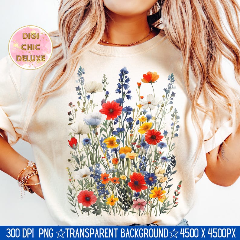 May include: A white t-shirt with a colorful floral design featuring red, blue, yellow, and white flowers. The design is centered on the shirt and extends from the neckline to the bottom hem.