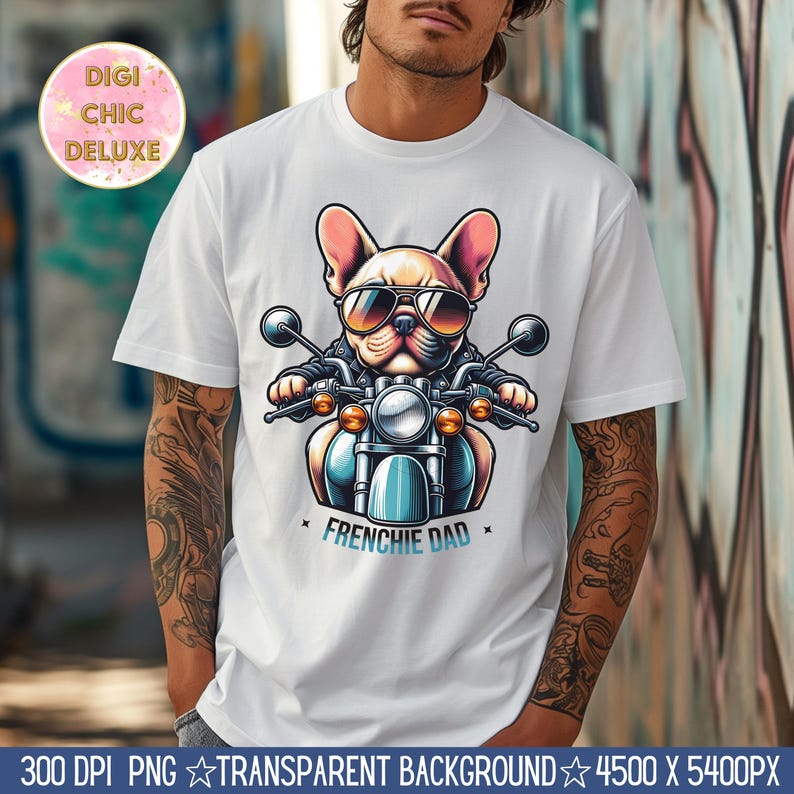 Puede incluir: Una camiseta blanca con un gr&aacute;fico de un bulldog franc&eacute;s con gafas de sol y conduciendo una motocicleta. El texto "Frenchie Dad" est&aacute; impreso debajo del gr&aacute;fico.