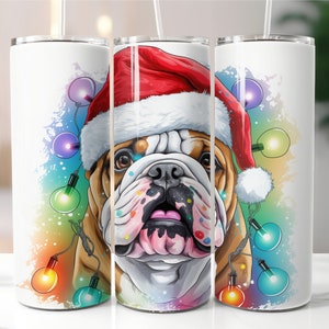 May include: A white tumbler with a colorful illustration of a bulldog wearing a Santa hat and surrounded by Christmas lights.