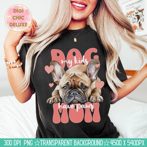 May include: A black t-shirt with a pink graphic design featuring a French bulldog with the text "Dog my kids have paws Mom".