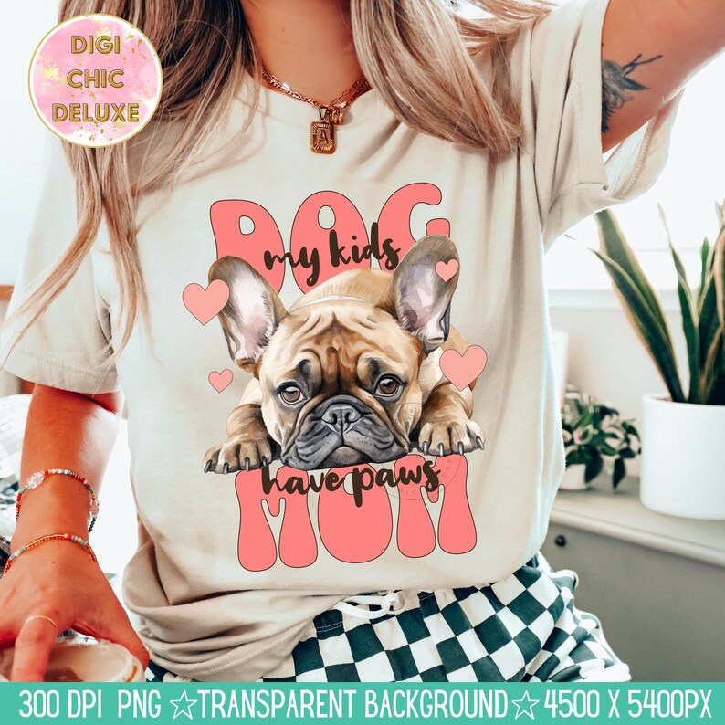 May include: A white t-shirt with a pink graphic of a French bulldog with the text "My kids have paws Mom".