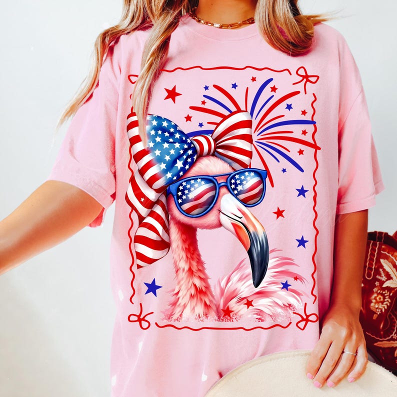 High quality hand drawn watercolor patriotic flamingo PNG design with USA flag coquette bow and American sunglasses, surrounded by red, white and blue fireworks. Perfect for 4th of July shirts, Independence Day outfit, beach party tee, funny summer graphic t-shirt tee, July Fourth flamingo lover gift, America-themed BBQ look, retro cute animal design, and trending patriotic women’s apparel. Great for lake days, family matching sets, coastal grandma style, and summer vacation fashion.