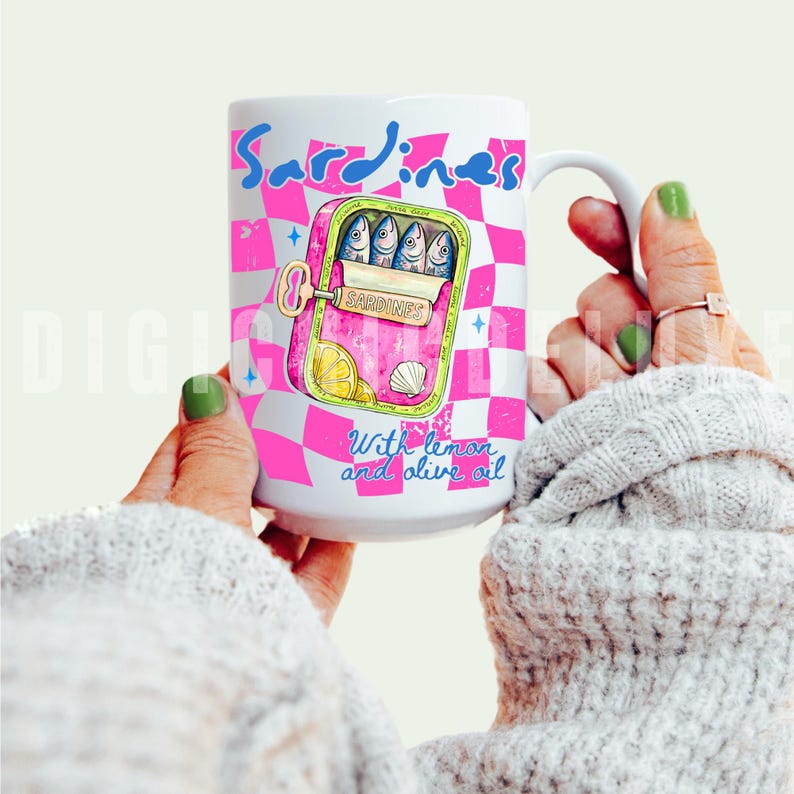 Trendy sardines shirt design featuring a pink illustrated sardine tin can with fish, lemon slices, shell detail, blue lettering, and hot pink checkerboard background. Cute Mediterranean foodie graphic perfect for coastal Europe vacations, European summer outfits design, fish market aesthetic, seafood lover gifts, retro vacation shirts design, beach trip apparel design, coastal boutique fashion, and trendy graphic shirt design for women, girls trips, and summer travel. For sublimation and DTF.