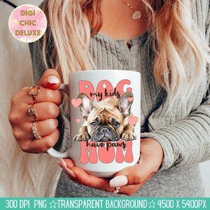 May include: White ceramic mug with a pink design featuring a French bulldog and the text "Dog my kids have paws Mom".