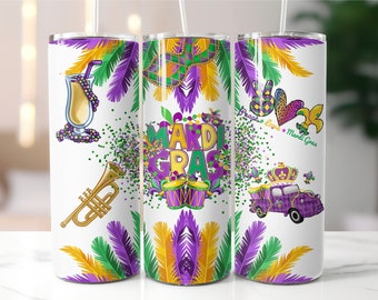 May include: Three 20 oz stainless steel tumblers with a Mardi Gras theme. The tumblers feature a white background with purple, green, and gold accents. One tumbler features a trumpet, a cocktail, and beads. Another tumbler features the words "Mardi Gras" with a drum and a mask. The third tumbler features a truck with a crown, a peace sign, a heart, and the words "Peace Love Mardi Gras".