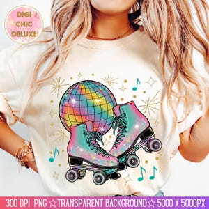 May include: Cream-colored t-shirt featuring a colorful disco ball and a pair of roller skates with teal laces. The skates and disco ball have a rainbow gradient design. Gold starbursts and musical notes accent the design. The text "DIGI CHIC DELUXE" is in the upper left corner.